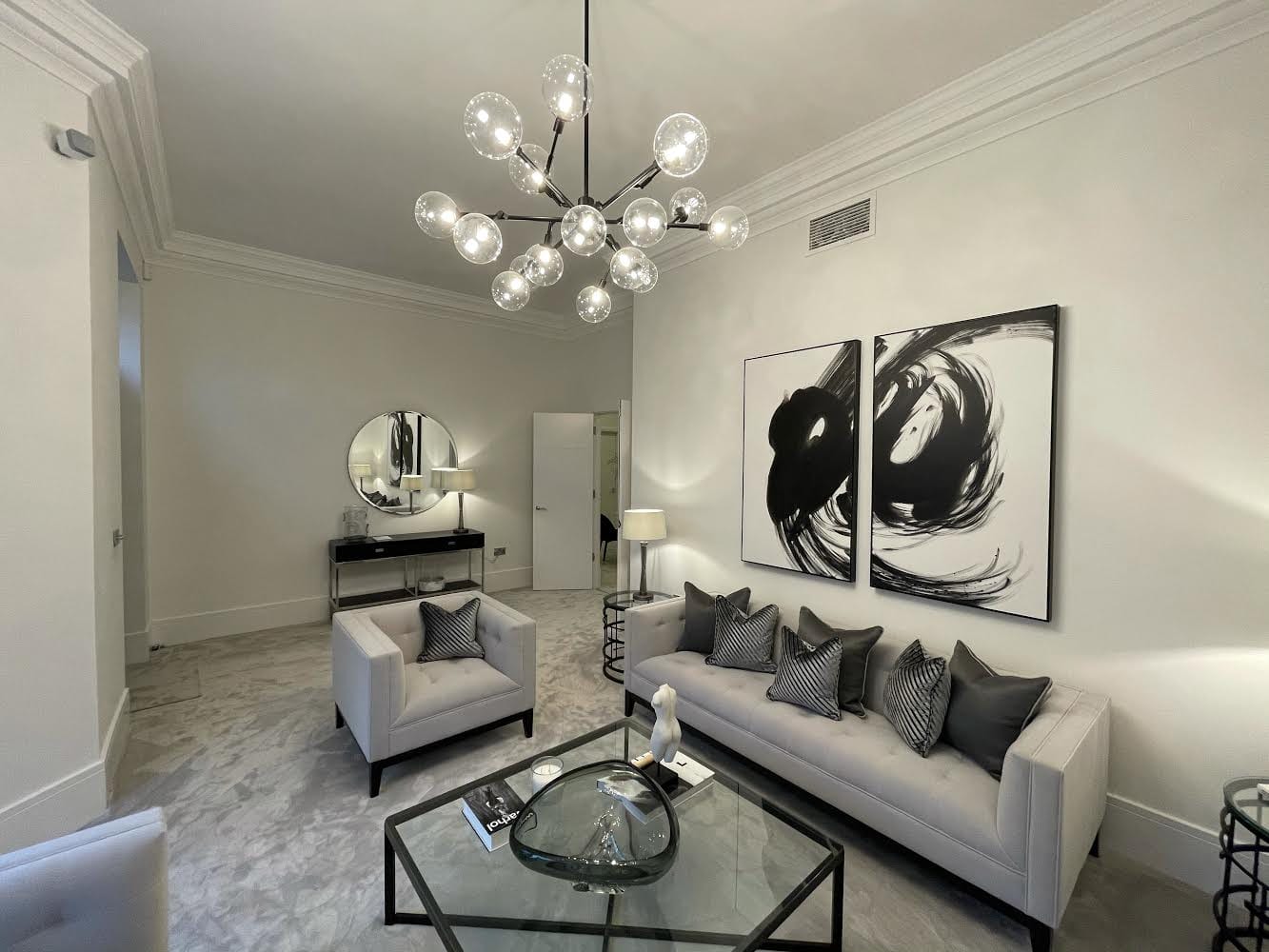 Pale fitted carpet throughout an elegant living room